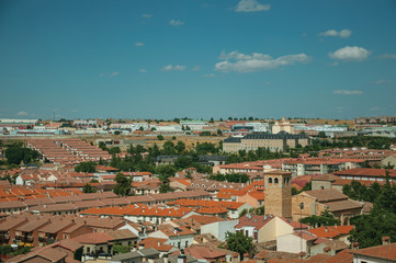 Fototapeta na wymiar Cityscape and church with belfry at the outskirt of Avila