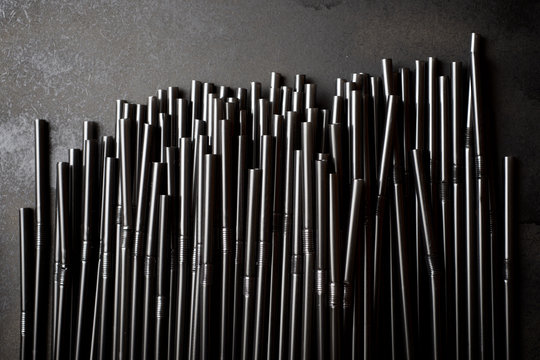 Drinking straws on a black table