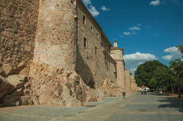 Fototapeta na wymiar Pedestrian promenade beside large city wall at Avila