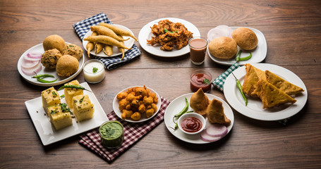 Indian Tea time snacks  in group includes Veg Samosa, Kachori/kachaudi, aloo bonda, khaman dhokla,...
