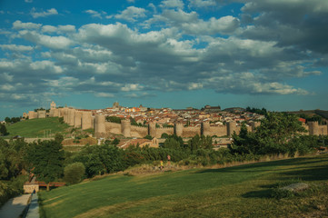 Fototapeta na wymiar City landscape with large stone wall and towers at Avila