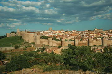 Stone towers with large wall encircling the city of Avila
