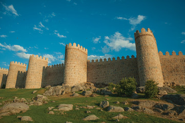 Stone towers over rocky landscape encircling the town of Avila