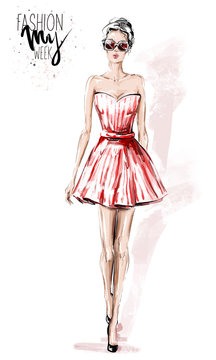 Hand drawn beautiful young woman in red dress. Stylish elegant girl. Fashion woman look. Sketch. Fashion illustration.