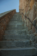 Staircase going up towards a thick wall in Avila