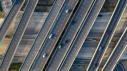 Aerial top view of highway, Transport city junction road with car on Intersection cross road shot by drone