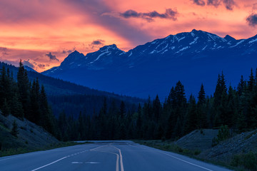 Beautiful sunset over a mountain road in the icefields parkway near Jasper