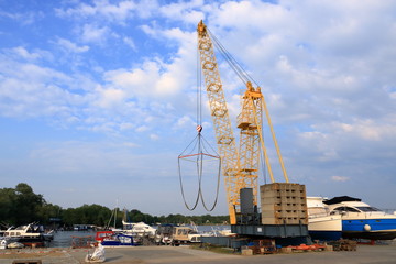 Fototapeta na wymiar Boat Crane at Marina in Werder/Havel, Potsdam, Brandenburg, Germany