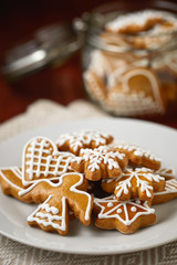 Christmas gingerbread on plate, homemade biscuits 