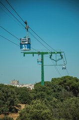 Cable car gondola and big supporting towers at the Teleferico Park of Madrid