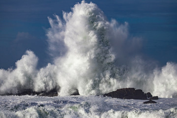waves crashing on rocks