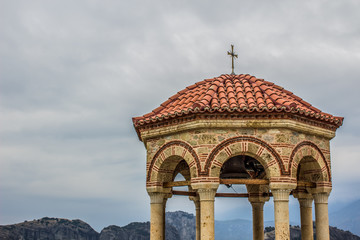 gazebo dome medieval stone architecture building on cloudy gray sky background in highland Asian...