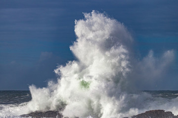 waves crashing on rocks
