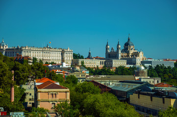 Royal Palace and Almudena Cathedral with buildings among trees in Madrid