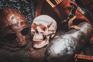 Ols rusted ancient helmet with human skull