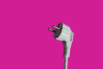 Electric plug closeup on pink background