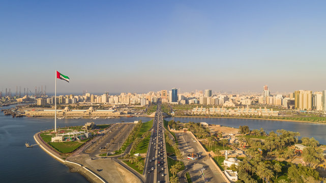 Aerial view of Flag Island and cityscape in Khalid Lake, Dubai, UAE.