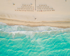 Aerial view of umbrellas and sun loungers on beach