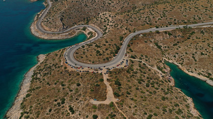 Aerial view photo of road in Athens riviera seaside known limanakia forming small bays with turquoise clear sea, Vouliagmeni, Attica, Greece