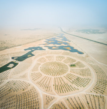 Aerial view of Al Qudra lakes in the middle of Saih Al Salam Desert in Dubai, UAE.