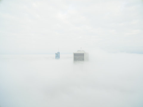 View Of Skyscrapers Over Clouds