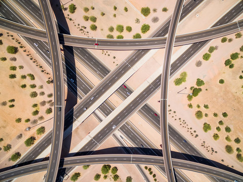 Aerial view road intersection on desert landscape