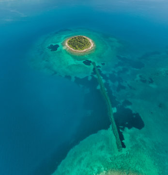 Aerial view of small islet of Itea called Agios Athanasios in Greece
