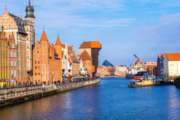 Fototapeta na wymiar Gdansk, Poland - February 08, 2019: View to historical waterfront of Gdansk's Main Town on the Motlawa River. Gdansk, Poland