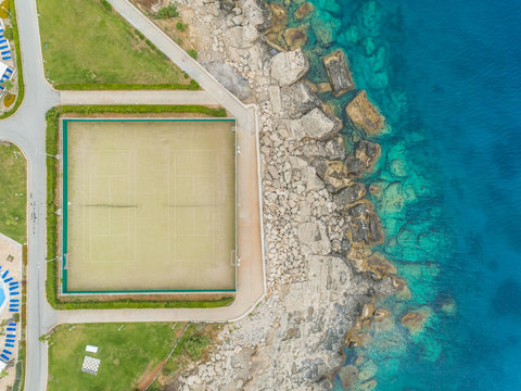 Aerial view of tennis court on seaside on Rhodes island, Greece.