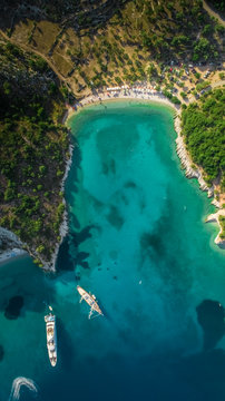 Aerial view of two boats moored in bay on island Ithaca in Greece.