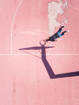 Aerial concept of a player on basketball court.
