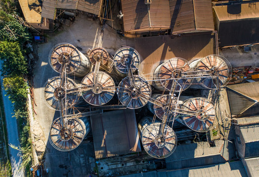 Aerial view of old rusty silos in an old farm.