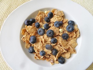 Bowl of cereal with fresh blueberries for a nutritional breakfast