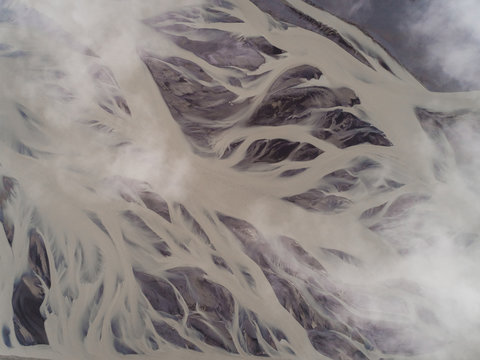 Aerial view above of glacial river on the southern region of Iceland.