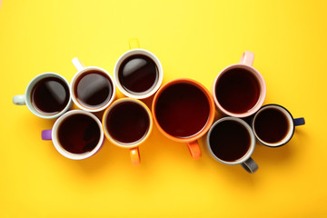 Black tea (coffee) in bright cups, office break, team building.