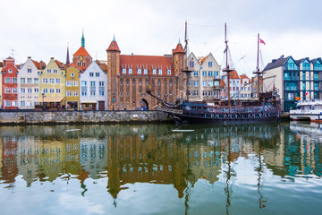 Fototapeta na wymiar Gdansk, Poland - February 06, 2019: View of Gdansk's Main Town and berth ships on the Motlawa River. Gdansk, Poland