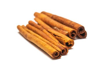 sticks of dry cinnamon tied with a twine (rope) on a white background, isolate for designers