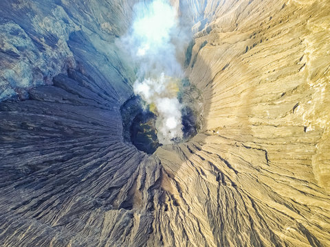 Aerial view of crater with smoke of the active volcano Bromo in Indonesia