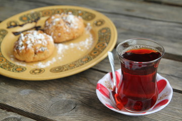 cup of tea on the table and cake