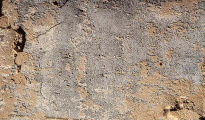 Old yellow clay wall background or texture, vintage style