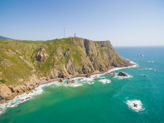 Sea view of lighthouse at Cabo da Roca cape, westernmost extent of mainland Portugal and continental Europe.