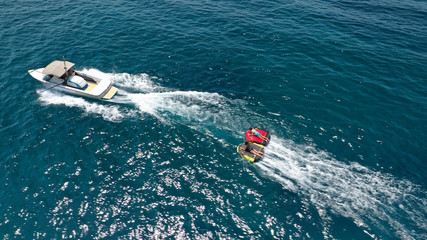 Obraz premium Aerial photo of extreme powerboat donut watersports crusing in high speed in tropical turquoise bay