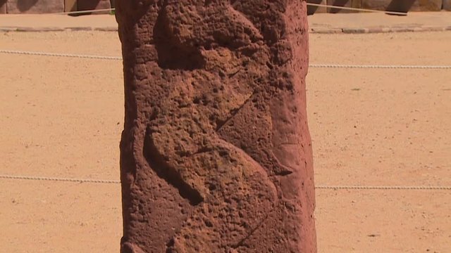 Extreme close-up low-angle tilting shot of  a snake-like carving on the Kalassaya temple sandstone monolith, La Paz, Bolivia