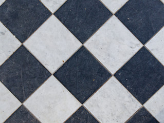Black and white wintage checkered floor tiles.