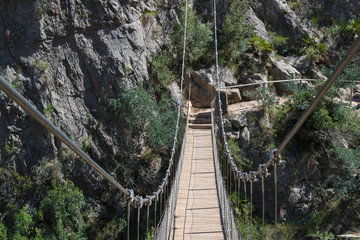 Fototapeta premium Suspension bridge in the route of the calderones, chulilla, valencia.
