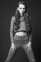Teen girl posing in studio. Black and white photo