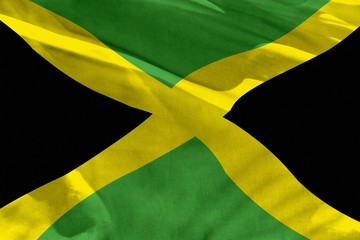Waving Jamaica flag for using as texture or background, the flag is fluttering on the wind