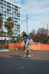 Man with afro hair proudly showing the American flag