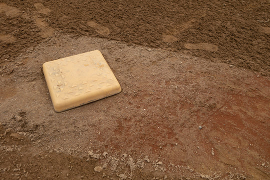 white home plate baseball sandy dirt field