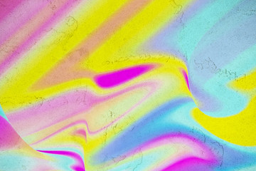 Abstract neon colorful fluid art on concrete background. Digital modern art. Flowing pink, blue, yellow, coral and purple colors. Blurred.